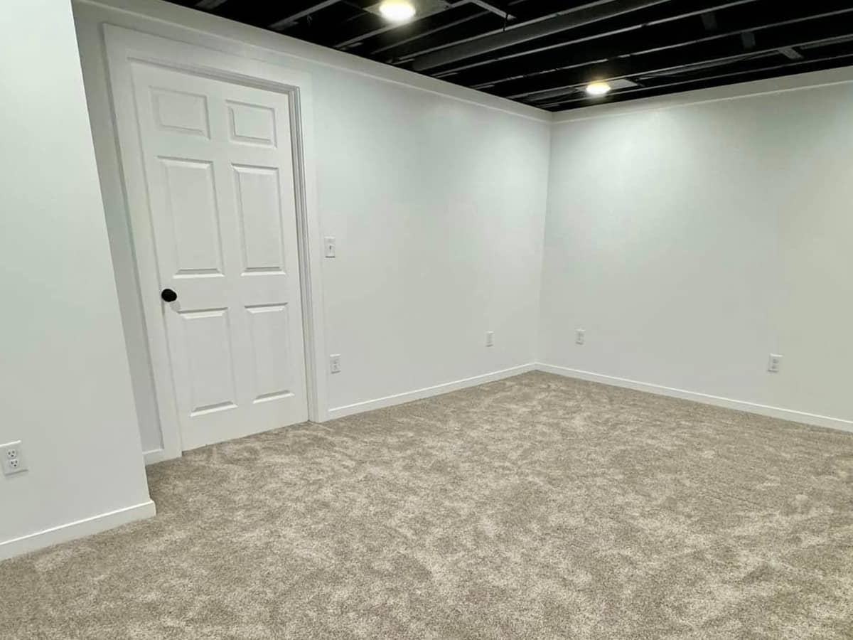 basement remodel with gray carpet