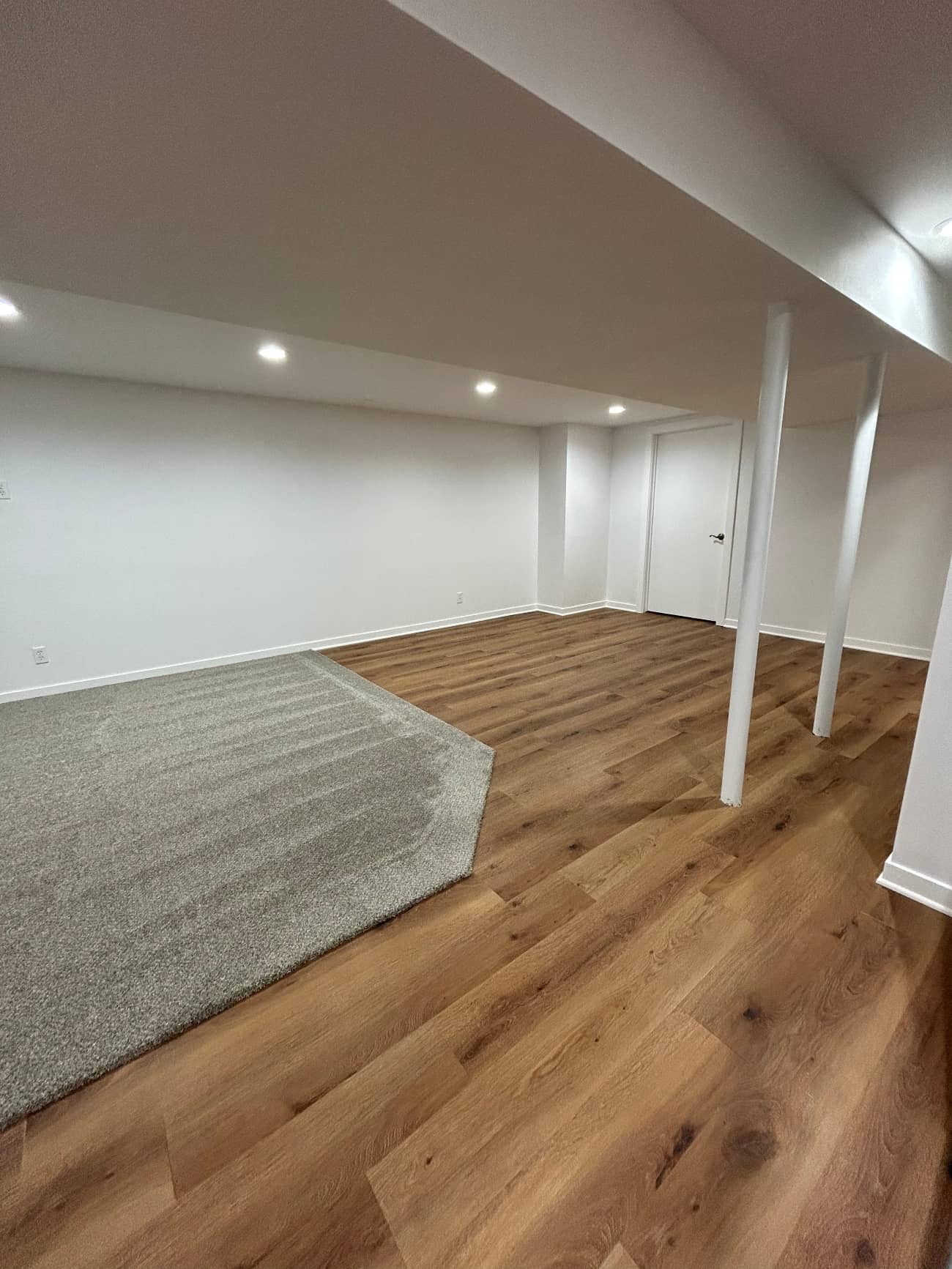 basement remodel with new hardwood flooring
