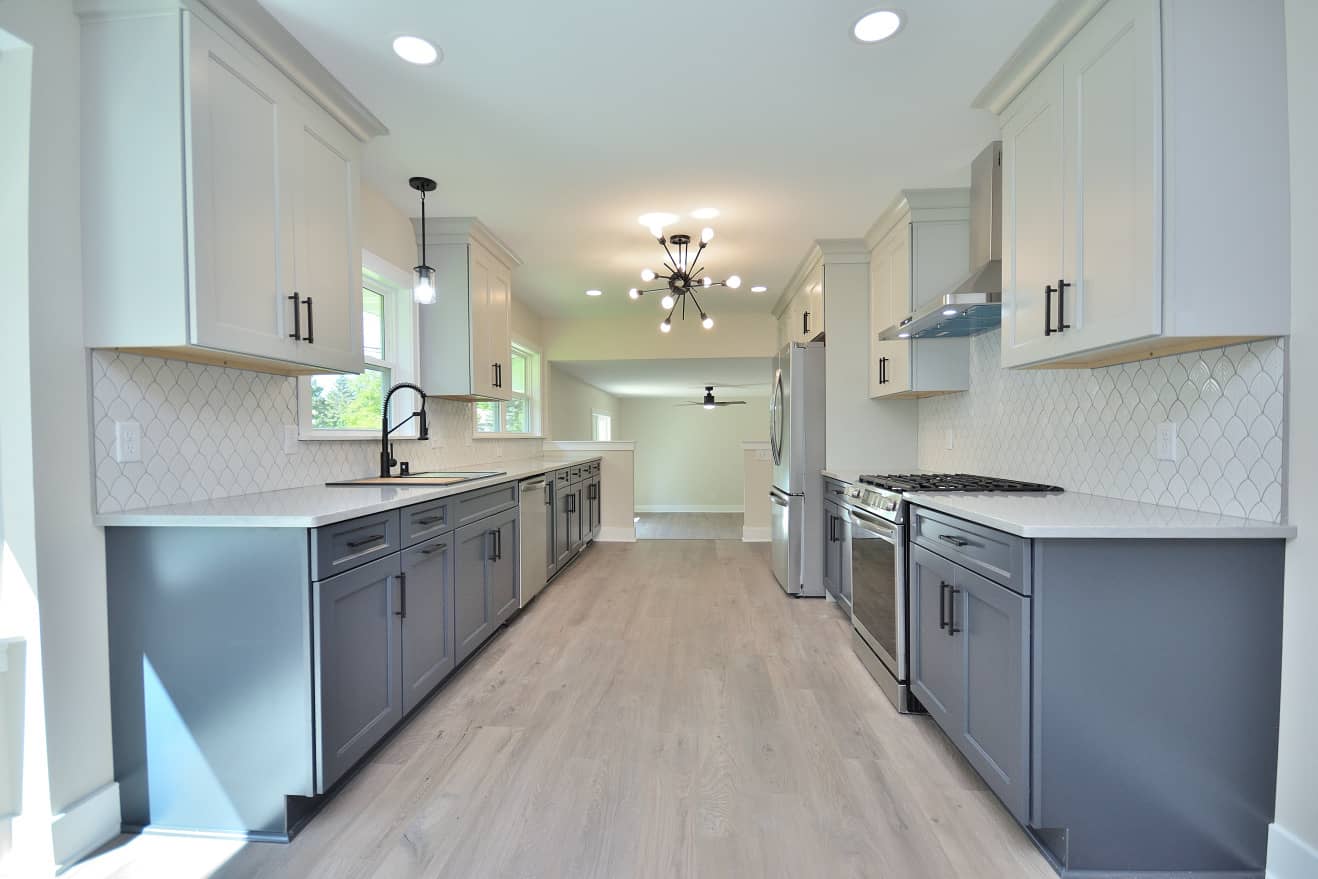 kitchen remodel with dark blue gray cabinets installed